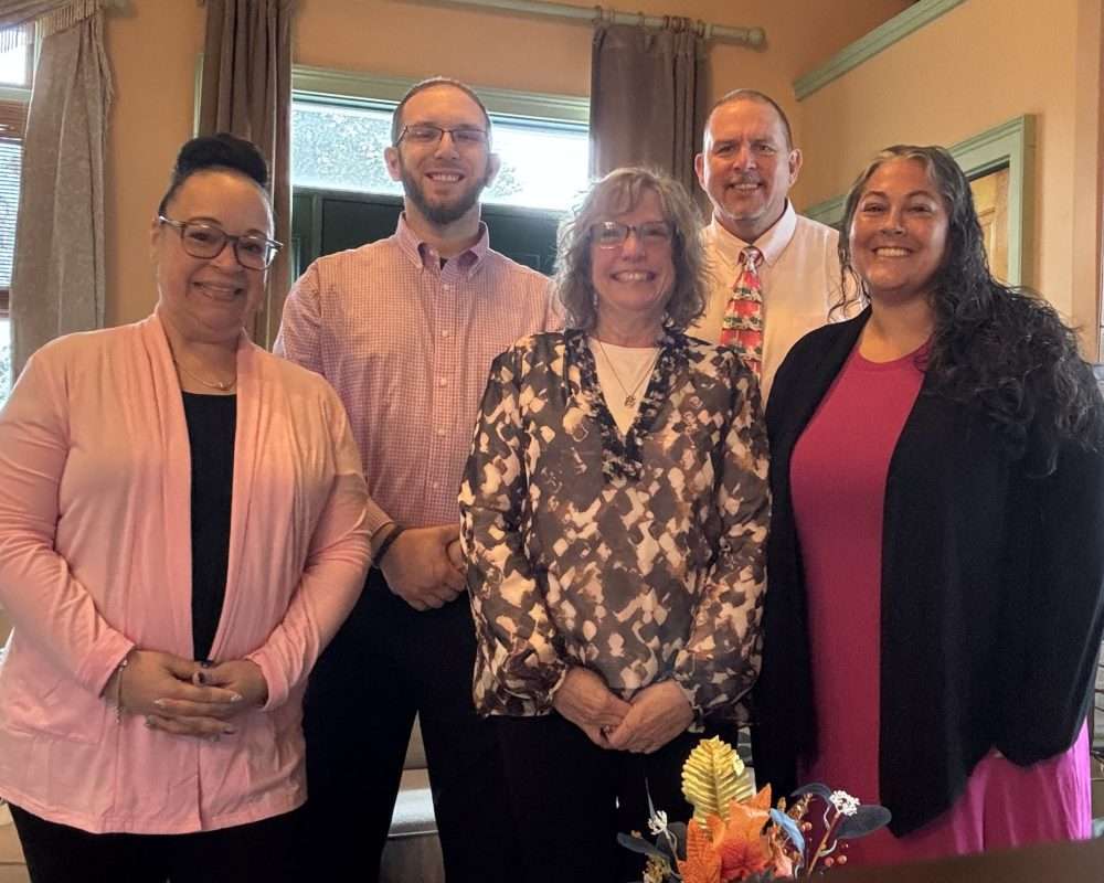 President and CEO Edward Ramsdell and Orion Protective Services staff wearing pink for Breast Cancer Awareness Month